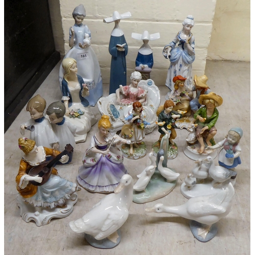 165 - Post World War II European china and porcelain figures and groups: to include examples by Lladro and... 