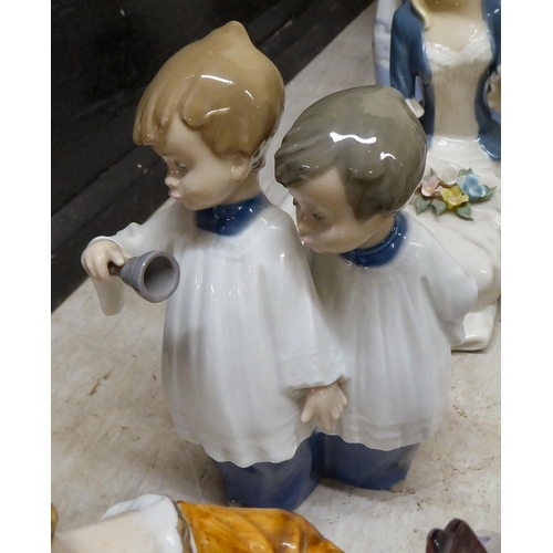 165 - Post World War II European china and porcelain figures and groups: to include examples by Lladro and... 