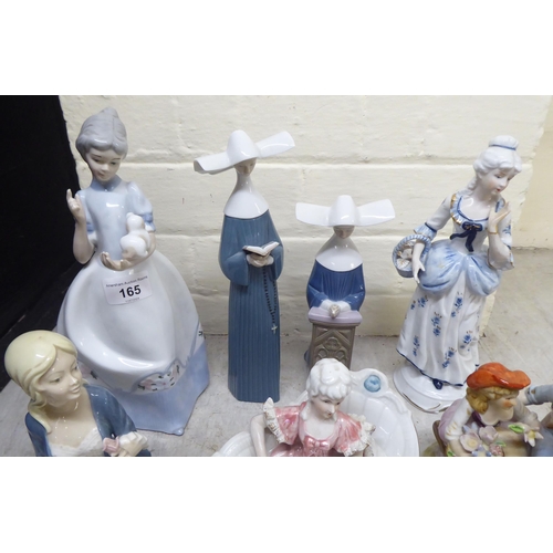 165 - Post World War II European china and porcelain figures and groups: to include examples by Lladro and... 