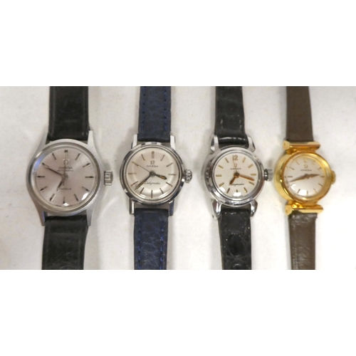 102 - Four ladies Omega stainless steel cased wristwatches, variously faced by baton dials, on hide straps