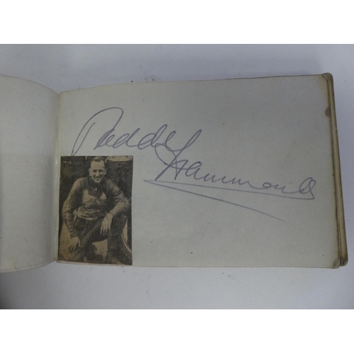 10 - A circa 1930s and later autograph album, bearing signatures and four loose postcards