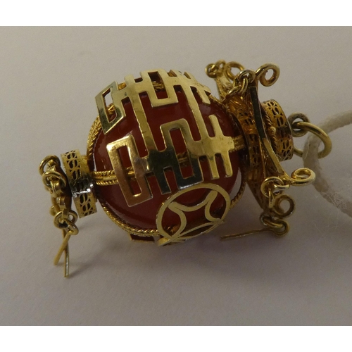 103 - A modern Chinese yellow metal lantern style pendant with original purchase receipt