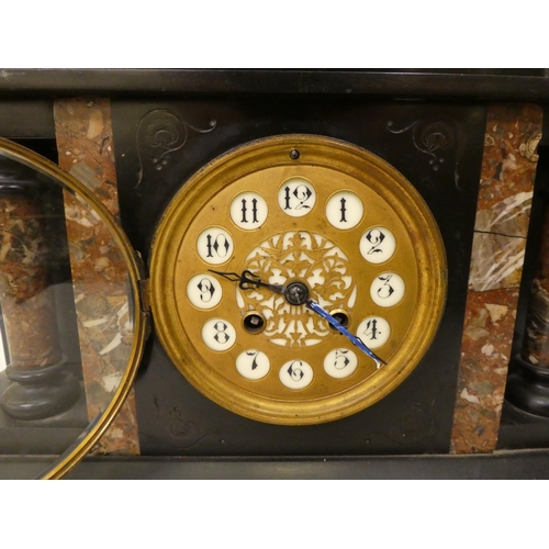 105 - A late 19thC black slate and marble mantel clock of architectural form; the gong strike movement fac... 