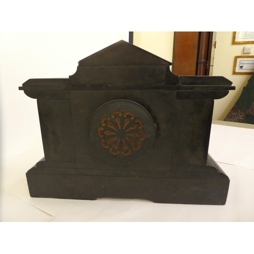 105 - A late 19thC black slate and marble mantel clock of architectural form; the gong strike movement fac... 