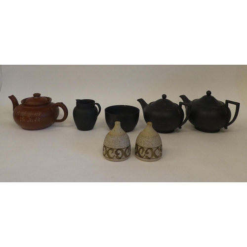 107 - Ceramics: to include Wedgwood bassalt teapots; and a Studio pottery salt and pepper  3.5