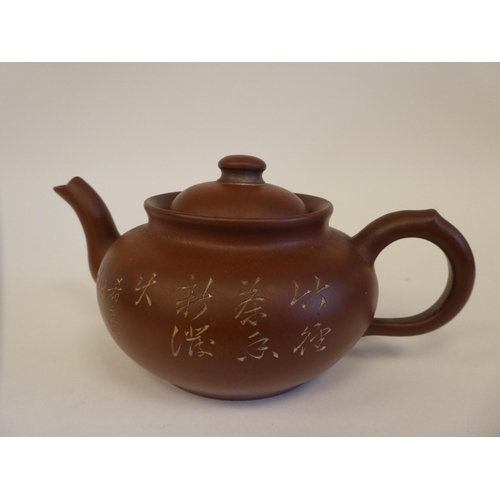 107 - Ceramics: to include Wedgwood bassalt teapots; and a Studio pottery salt and pepper  3.5