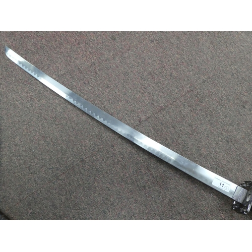 11 - An early/mid 20thC (possibly North African) machete, the blade 25