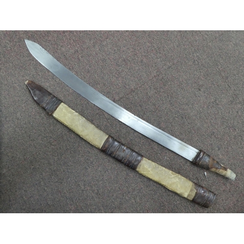 11 - An early/mid 20thC (possibly North African) machete, the blade 25