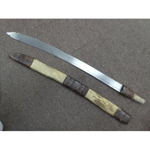 11 - An early/mid 20thC (possibly North African) machete, the blade 25