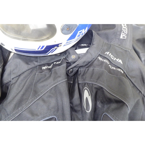 110 - Various motorcycle clothing: to include Mercury black leather trousers  size 36; and an FM helm... 