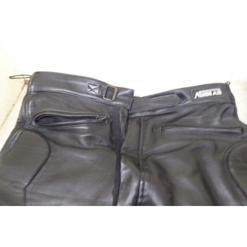 110 - Various motorcycle clothing: to include Mercury black leather trousers  size 36; and an FM helm... 