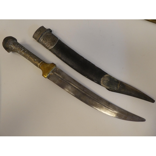 111 - Four various mid 19thC Asian edged weapons: to include a dagger with a curved blade  11