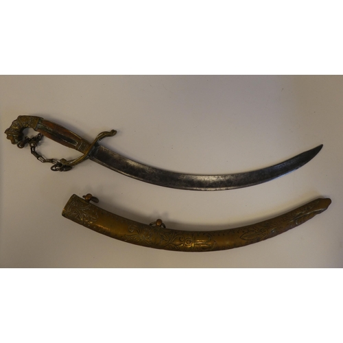 111 - Four various mid 19thC Asian edged weapons: to include a dagger with a curved blade  11