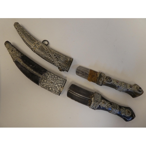 111 - Four various mid 19thC Asian edged weapons: to include a dagger with a curved blade  11