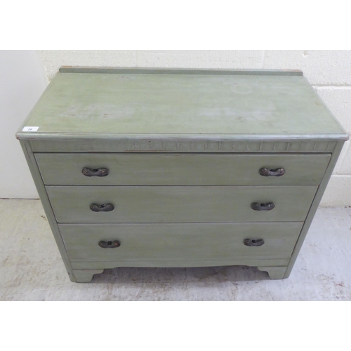 26 - A modern green wash painted, three drawer dressing chest, raised on bracket feet  29