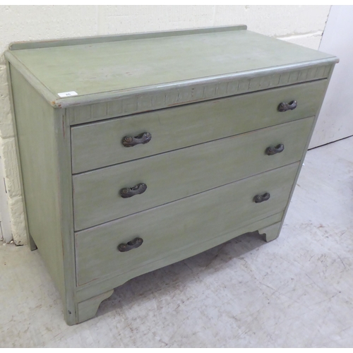 26 - A modern green wash painted, three drawer dressing chest, raised on bracket feet  29