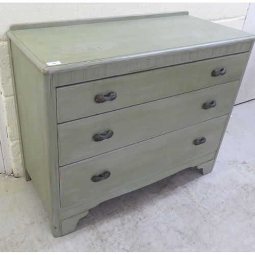 26 - A modern green wash painted, three drawer dressing chest, raised on bracket feet  29