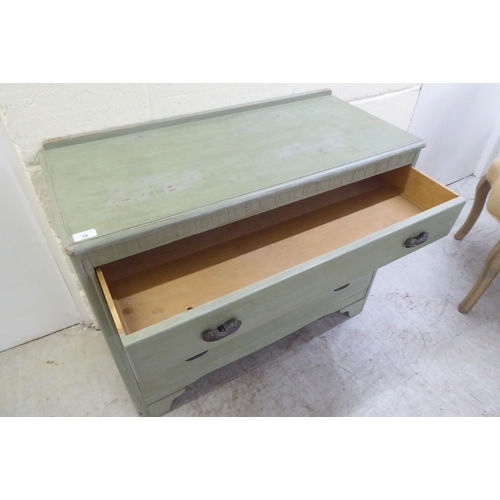 26 - A modern green wash painted, three drawer dressing chest, raised on bracket feet  29