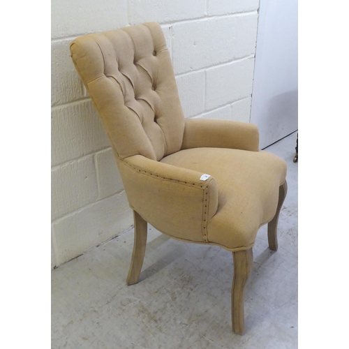 36 - A modern French inspired fabric covered bedroom chair, raised on cabriole forelegs