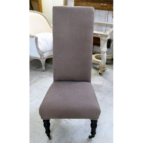 50 - A William IV and later fabric upholstered high back nursing chair, raised on turned forelegs and cas... 