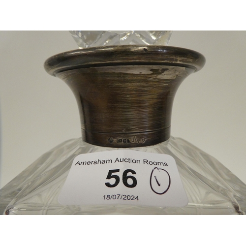 56 - An Asprey glass decanter with a silver collar