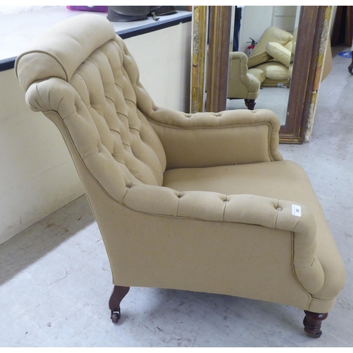 60 - An early 20thC and later fabric upholstered, enclosed arm salon chair, raised on turned forelegs and... 