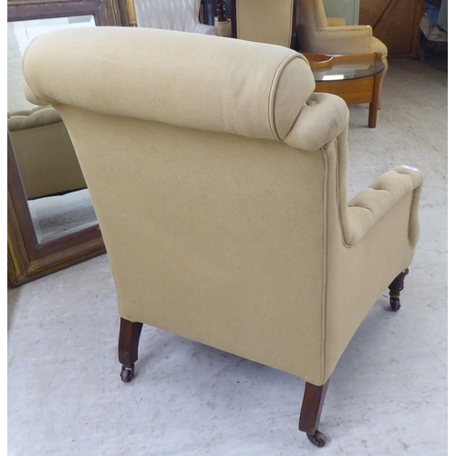 60 - An early 20thC and later fabric upholstered, enclosed arm salon chair, raised on turned forelegs and... 