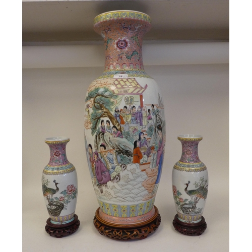 78 - Three 20thC Chinese porcelain vases on stands, each decorated with figures in a landscape  one ... 