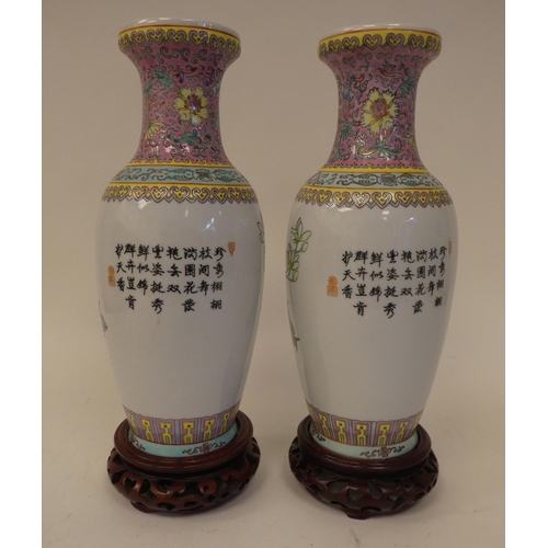 78 - Three 20thC Chinese porcelain vases on stands, each decorated with figures in a landscape  one ... 