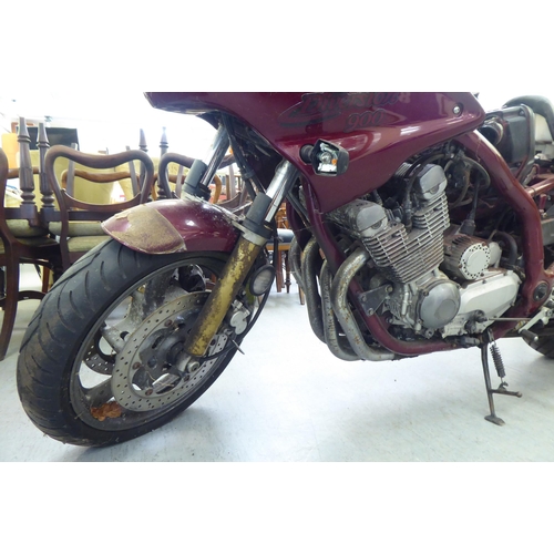 79 - A 'barn find' 1999 Yamaha 900 motorcycle in maroon livery, 892cc 4 cylinder, petrol (partly dismantl... 