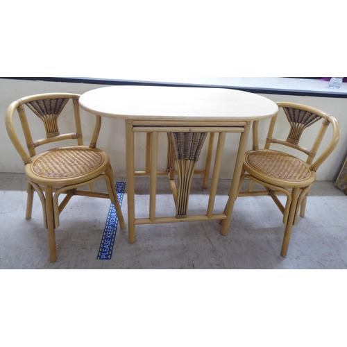 84 - A modern caned and bentwood effect, two person breakfast table and chairs  30