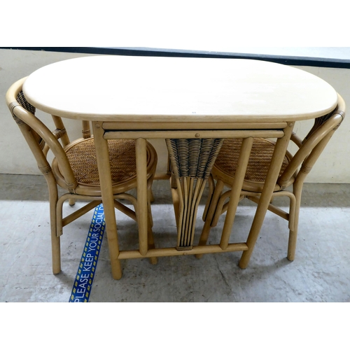 84 - A modern caned and bentwood effect, two person breakfast table and chairs  30