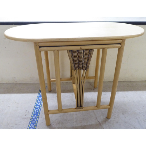 84 - A modern caned and bentwood effect, two person breakfast table and chairs  30