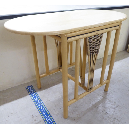 84 - A modern caned and bentwood effect, two person breakfast table and chairs  30