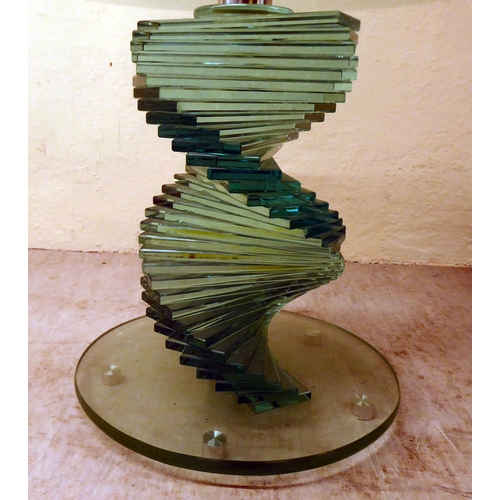 89 - A glass occasional table with a swirling staircase style pedestal  20