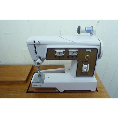 93 - A Singer sewing machine within a teak cabinet  30