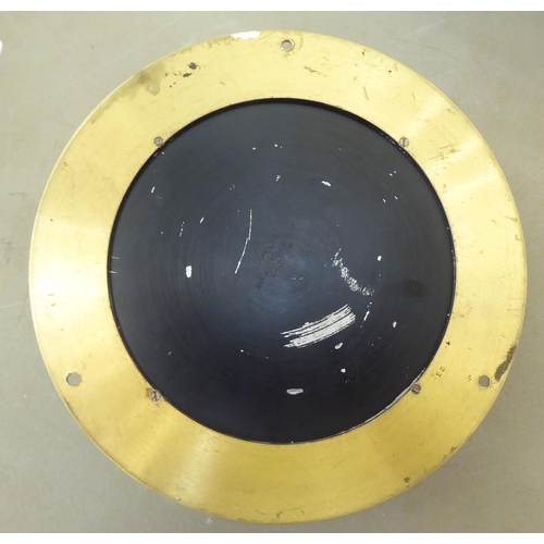 108 - A 20thC lacquered brass cased, bulkhead timepiece of drum design; the movement with sweeping seconds... 