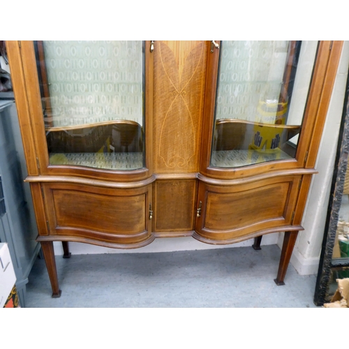 406 - An Edwardian satinwood string inlaid mahogany and marquetry display cabinet with a low upstand, over... 