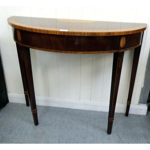 408 - A modern reproduction of a Georgian crossbanded string inlaid D-end console table, raised on square,... 