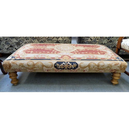 413 - A modern tapestry upholstered, cushioned top, long footstool, raised on turned pine legs  49