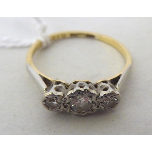 436 - An 18ct gold and platinum three stone diamond ring 