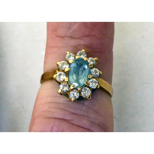 438 - An 18ct gold aquamarine cluster ring 