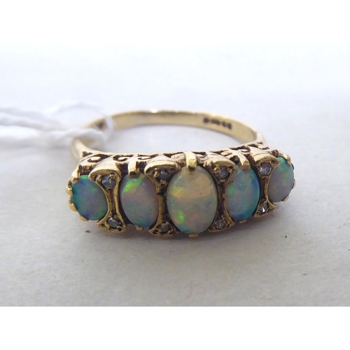 439 - A 9ct gold five opal stone and diamond set ring