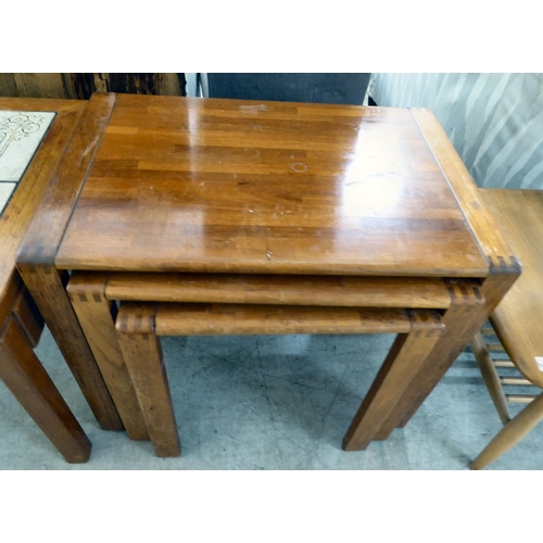 82 - A modern teak framed coffee table with a glass inset and four pottery tile top, raised on square leg... 