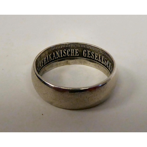 405 - A German East African Society white metal band ring  bears an inscription