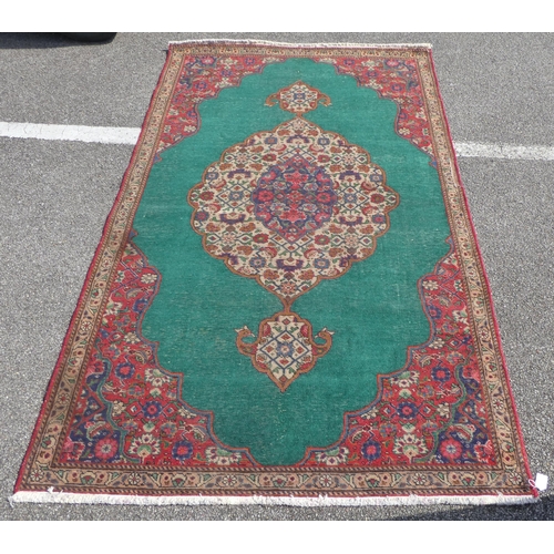 277 - An Iranian rug, on a red and green ground  56