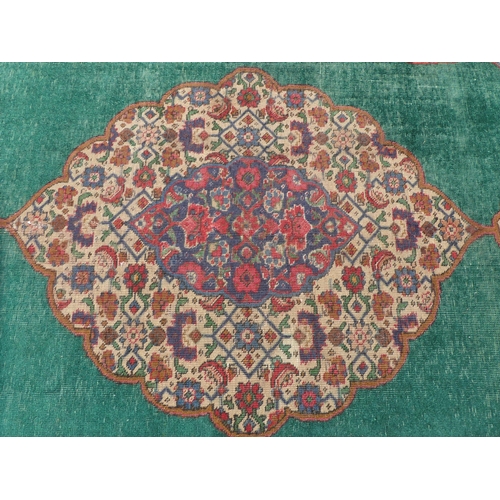 277 - An Iranian rug, on a red and green ground  56