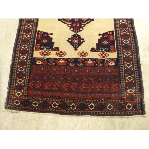 274 - A Persian rug, decorated with a central medallion, on a beige and maroon ground  64