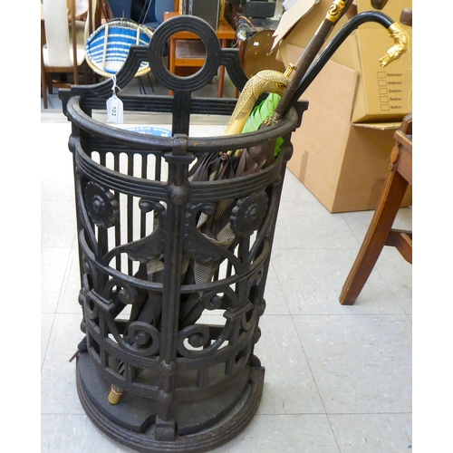 103 - A Victorian style black painted cast iron semi-circular stickstand  29