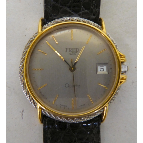 104 - A bi-coloured stainless steel cased wristwatch, the quartz movement faced by a silvered steel baton ... 